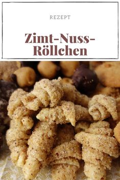 a close up of food on a plate with the words zimt - nuss rotellen