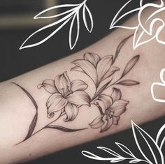 a black and white flower tattoo on the arm