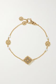 Family-run Buccellati honors its rich heritage by employing the same traditional techniques as when it first launched in 1919. Inspired by the ornate motifs seen through Renaissance opera houses, this bracelet has been handmade in Italy from 18-karat gold and strung with intricate charms and mother-of-pearl rounds. The delicate chain can be worn at two lengths. Gold Luxury Jewelry, Intricate Jewelry, Luxury Gold Pearl Bracelet, Luxury Baroque Jewelry For Opera, Luxury Victorian Gold Bracelet, Buccellati Jewelry Earrings, Buccellati Bracelet, Buccellati Jewelry, Pearl Bracelet Gold