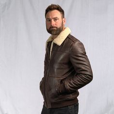 A leather jacket as rugged and iconic as the battle-tested captains of the sky. Where classic aviator style meets first-class quality and design. Crafted with 100% genuine lambskin leather, our brown leather bomber jacket features a zip closure, ribbed cuffs and waist, and a detachable sherpa collar to provide extra warmth and comfort for brisk nights on the town or chasing the horizon. On the outside, right away you’ll notice the buttery soft lambskin leather. From day one, it has that vintage, Shearling Leather Jacket, Aviator Leather Jacket, Leather Shorts Women, Short Leather Skirts, Distressed Jacket, Sheepskin Jacket, Aviator Jackets, Aviator Style, Leather Shirt