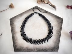 "Modern brutalist spine chain choker necklace. ~ choker features a single bold strand of 5/8\" {14 mm) wide textured somber black matte fishbone spine chain ~ necklace closes in back with a black matte lobster clasp, and has an additional 3.5\" black matte adjustable extender chain {ex. 14\" necklace option can adjust up to 17.5\" long} ~ measure your neck where you desire to wear this piece - higher up for choker option, or lower along collarbones for a looser fit ~ choose closest size from dro Spine Bone, Chunky Choker, San Angelo, Punk Jewelry, Goth Punk, Chain Choker Necklace, Choker Collar, Fish Bone, Necklace Choker