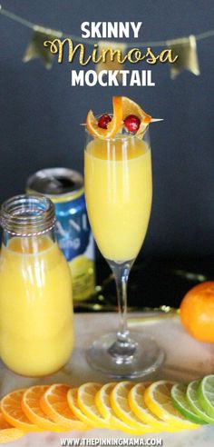 two glasses filled with orange juice and garnished with cherries on the rim