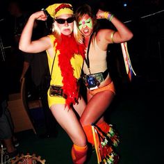 two women dressed up in costumes at a party