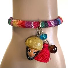 These are beautiful artisanal bracelets that will make an excellent accessory and pop of color for any outfit. Each piece is completely unique and 100% hand made by a local artisan in Tuxtla Gutierrez, Chiapas Mexico. The bracelets have an adjustable slide knot. They each come with 1 natural Chiapas amber bead, 1 Parachico, 1 tassel and 3 other beads.  Red Tassel Bracelet  Width - 1/2 cm Parachico - 1 inch Tassel - 1 inch Fits wrists between 5" - 9.5" Blue Tassel Bracelet  Width - 1 cm Parachico - 1 inch Tassel - 1 inch Fits wrists between 5 1/2" - 9" All of our handcrafts and folk art are handmade and may have slight imperfections that make them unique & one of a kind. Colors vary slightly depending on the lighting or viewing screen. Bracelet Mexican, Blue Tassel, Tassel Bracelet, Amber Beads, Macrame Bracelets, Local Artisans, Braided Bracelets, Friendship Bracelet, Friendship Bracelets