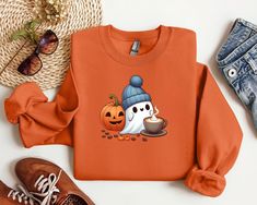 Celebrate the spooky season with our Cute Spooky Coffee Sweatshirt! Perfect for fall coffee lovers and Halloween parties, this cozy women's ghost sweatshirt blends comfort with festive style. Featuring a playful ghost design, it's the ideal choice for chilly autumn days and Halloween fun. Stay warm and stylish this season with your new favorite fall graphic shirt! Funny Long Sleeve Sweatshirt For Fall, Spooky Coffee, Ghost Sweatshirt, Fall Graphic, Coffee Sweatshirt, Teacher Design, Ghost Design, Fall Coffee, Autumn Days