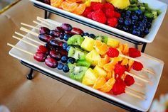 two trays filled with different types of fruit