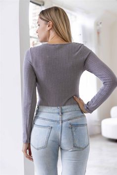 🖤 Be effortlessly stylish in our Ribbed Cut-Out Twisted Detail Bodysuit. Made in a trendy grey color, this bodysuit features a ribbed texture, cut-out twisted detail, and long sleeves for a fashionable and cozy look. The fitted and semi-stretchy design offers comfort and versatility for any occasion. Perfect for a casual, yet cute everyday look. (Double snap closure and unlined. Just throw on and go!) 🖤 Item Features: Grey, solid color, ribbed, cut-out twisted detail, long sleeve, crew necklin Solid Ribbed V-neck Bodysuit, Solid Color Ribbed V-neck Bodysuit, Casual Gray Long Sleeve Bodysuit, Trendy V-neck Ribbed Bodysuit, Casual Ribbed Stretch Bodysuit, Trendy Fitted Gray Bodysuit, Trendy Gray Bodysuit For Spring, Casual Long Sleeve Ribbed Bodysuit, Casual Ribbed Bodysuit For Spring