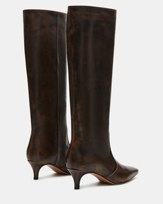 Upgrade your boot game with the LANDER boots. These boots have a square toe, knee-high length, and a trendy kitten heel and elevate any outfit while providing comfort and support. Perfect for everyday wear or dressing up for a night out. 2 inch heel height 14.75 inch shaft circumference 15.25 inch shaft height Leather upper material Textile and synthetic lining Synthetic sock Synthetic sole Imported Brown Kitten Heel Boots, Fitted Low Heel Boots With Reinforced Heel, Wide Calf Low Heel Knee-high Boots For Work, Wide Calf Knee-high Boots With Low Heel For Work, Fitted Boots With Low Stacked Heel, Fitted Boots With Sculpted Low Heel, Wide Calf Low Heel Boots With Reinforced Heel, Wide Calf Mid-calf Boots With Sculpted Heel For Fall, Fall Wide Calf Mid-calf Boots With Sculpted Heel