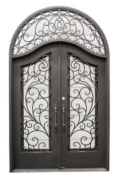 an ornate iron door with glass panels on the top and bottom panel, is shown