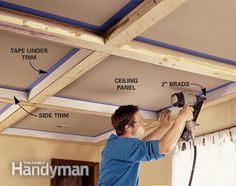 a man is fixing the ceiling in his house