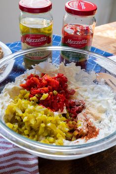 the ingredients for this dish are mixed together in a glass bowl on top of a wooden table