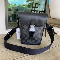 Signature Coated Canvas And Smooth Calf Leather Inside Multifunction Pocket Speedclip Closure, Fabric Lining Adjustable Strap With 24" Drop For Shoulder Or Crossbody Wear 6 1/4" (L) X 7 1/4" (H) X 2 1/2" (W) Style No. C3134 Coach Black Shoulder Bag With Snap Closure, Black Coach Shoulder Bag With Snap Closure, Black Functional Coach Shoulder Bag, Coach Saddle Bag, Grey Crossbody Bag, Coach Legacy, Purse Brands, Boho Purses, Coach Crossbody