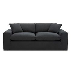 a black couch sitting on top of a white floor