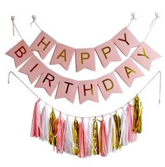 a happy birthday banner with tassels and streamers