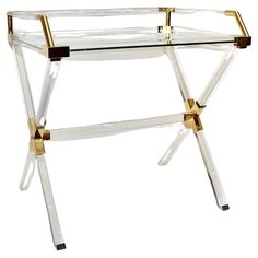 a clear and gold tray with two handles on each side, sitting on a white surface