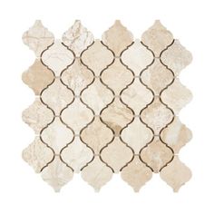 a white and beige tile with an intricate design on the back side, in various sizes