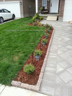 the front yard is clean and ready to be used as a flower bed for landscaping