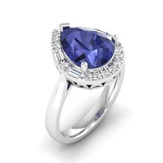 Introducing our exquisite pear-shaped tanzanite and diamond ring, a true embodiment of elegance and sophistication. Crafted with meticulous attention to detail, this stunning piece showcases a lustrous pear-shaped tanzanite at its center, radiating a captivating blue hue that symbolizes wisdom and royalty. Surrounding the tanzanite are dazzling diamonds, meticulously set to enhance its brilliance and create a mesmerizing contrast. With its timeless design and impeccable craftsmanship, this ring Elegant Pear-shaped Sapphire Ring For Formal Occasions, Elegant Formal Pear-shaped Sapphire Ring, Elegant Blue Pear-shaped Sapphire Ring, Formal Pear-shaped Sapphire Ring, Teardrop Sapphire Ring With Accent Stones For Formal Events, Formal Teardrop Sapphire Ring With Accent Stones, Elegant Blue Pear-shaped Diamond Ring, Elegant Teardrop Sapphire Ring With Center Stone, Elegant Pear-shaped Sapphire Ring With Halo Setting