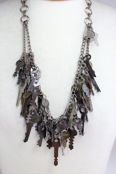 "Vintage Antique Distressed Keys Skeleton Keys Lock Handcrafted Repurposed Statement Charm Necklace OOAK Steampunk Novelty Quirky Jewelry. Love the vintage look in your home??? Incorporate it into your dressing as well This hand crafted double strand statement necklace contains an assortment of 45 vintage, distressed keys of various complimentary sizes that I have collected over the years. Also attached is a little lock and key that you can take off and use if you choose! Measures 16 1/2\" long. Old Keys Crafts Diy, Repurposed Accessories, Junk Necklace, Necklace Keys, Old Key Crafts, Clutter Necklace, Skeleton Key Lock, Goodwill Bins, Junk Jewellery