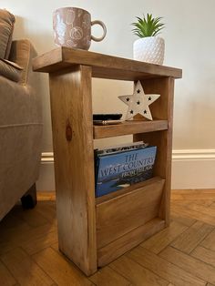 a wooden shelf with books and a mug on it