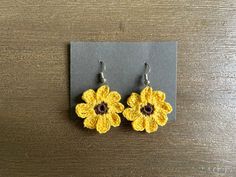 This is a pair of yellow crochet sunflower earrings. Perfect for any outing or occasion, especially in the warm months. This is a physical item, not a PDF or a pattern. More colors coming soon! Casual Handmade Yellow Earrings, Handmade Casual Flower Earrings, Casual Handmade Flower-shaped Earrings, Casual Handmade Flower Earrings, Casual Handmade Flower Shaped Earrings, Yellow Crochet Jewelry Gift, Crochet Sunflower Earrings, Crochet Yellow, Yellow Crochet