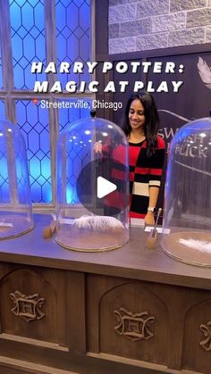 a woman standing in front of some glass domes