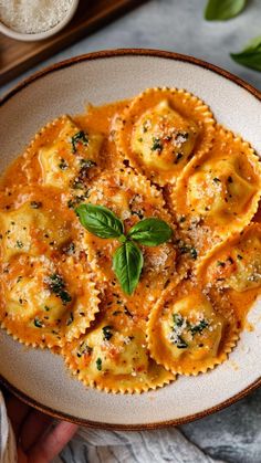 Creamy Tomato Ravioli Sauce: 🍅🧄🍝 A luscious, tomato-based cream sauce perfect for ravioli.