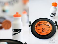 an orange and black basketball sitting on top of a table next to a white bottle