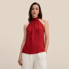 Step into the season with sophistication in our Women's Silk Halter Tank Top. Designed with a lightweight and soft 10 Momme Georgette silk, this top offers a smooth and elegant appeal that drapes beautifully for a flattering fit. The halter neckline and charming bow-tie decoration add a touch of femininity and class to your wardrobe, making it a must-have for any fashion-conscious woman. Key Features Fabric Type: Luxurious satin-finish silk Design: Halter neck with adjustable bow-tie Fit: Relaxed and comfortable fit Pattern: Solid for easy pairing Elasticity: Non-stretch for a structured look Seasonality: Perfect for Spring and Summer wear Product Benefits Embrace the perfect blend of style and comfort with our Silk Halter Tank Top. Here's why you'll love this top: Timeless Elegance: The s Red Pomegranate, Halter Tank Top, Halter Tank, Silk Tank Top, Halter Tops, Halter Neck Top, Silk Tank, Summer Party, Summer Wear