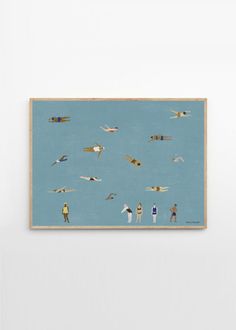 there are many people flying kites in the sky on this blue wall art print