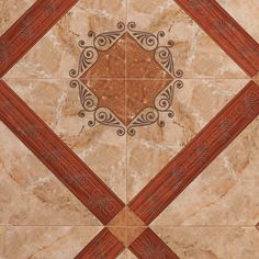 a tile floor with an intricate design on the top and bottom corner, in brown tones