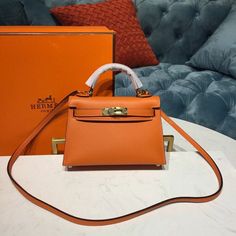 Description Rep 1:1 Comes with dust bag,with padlock and two keys, gift bag, and paper work, receipt, gift box with... Mini Kelly, Louis Vuitton Shirt, Togo Leather, Kelly Bag, Orange Bag, Orange Leather, Mini Crossbody Bag, Hermes Bags, Mini Crossbody