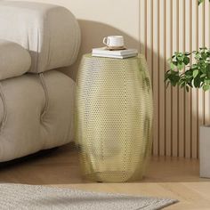 a yellow vase sitting on top of a wooden floor