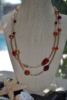 Double Strand Gold Orange and Red Necklace by uniquebeadingbyme, $26.00 Elegant Glass Beads With Beaded Chain, Elegant Double Strand Colorful Beaded Necklaces, Elegant Double Strand Beaded Necklace, Elegant Multi-strand Glass Beaded Necklaces, Multi-strand Glass Necklaces With Faceted Beads, Amber Beaded Czech Glass Necklaces, Glass Necklaces With Gold Round Beads, Glass Necklaces With Gold Beads, Faceted Beads Multi-strand Necklace