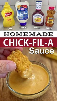 homemade chicken - fla sauce in a glass bowl with a hand dipping it into the dip