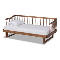 a wooden day bed with white sheets and pillows on it's bottom half, against a white background