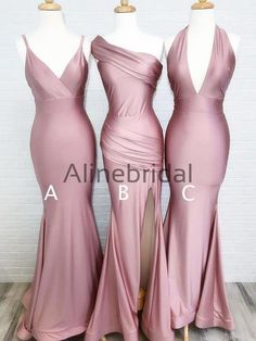 three bridesmaid dresses on mannequins in front of a brick wall