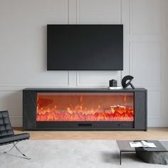 a living room with a television and fire place in the center, next to a black chair