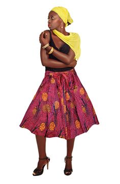 "Indulge in the ultimate feminine fashion statement with this African Print skirt with royal colors and interwoven textile. This new African Skirt is a pleated midi skirt suitable for any party, festival, beachwear, or casual wear. Our African skirts are trendy, cultural, universal admired, and reflect artistic integrity. Be royal with this regal African Print Midi Skirt! AFRICAN ●MIDI● SKIRT ● DETAILS ▶Materials: 100% Cotton ▶Length: Approximately 29  inches ▶Waist: Approximately 32 inches (Ela African Midi Skirt, Short Flare Skirt, African Print Midi Skirt, African Scarf, Orange Moon, White Pleated Skirt, Style Africain, African Print Skirt, African Skirts