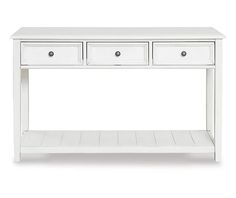 a white console table with three drawers