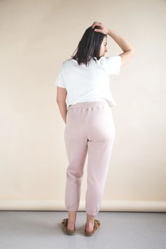 The Plateau Joggers are an elevated take on classic knit jogging pants. With a high rise, unique wrap-around pockets and a comfy elastic waist, they are ideal loungewear at home or on the street. View A is a relaxed fitting pant with an optional drawstring waist and two choices of ankle finish: a fabric cuff or gathered elastic hem. View B is a pair of shorts with a gently scalloped hem. Optional back pockets can be added to either view. Sizes: 0 to 20 New, uncut, paper pattern Sportswear Sweats With Elastic Waistband For Lounging, Super Soft Cotton Sweats For Loungewear, Relaxed Fit Joggers With Elastic Waistband And Tapered Leg, Relaxed Fit Joggers With Elastic Cuffs For Lounging, Relaxed Fit Tapered Leg Joggers With Elastic Waistband, Sportswear Joggers With Elastic Waistband For Loungewear, Athleisure Joggers With Elastic Waistband For Loungewear, Sporty Sweatpants With Elastic Waistband For Lounging, Comfy Solid Activewear With Elastic Waistband