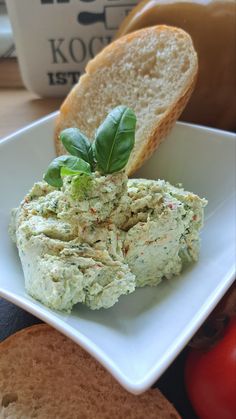 a white plate topped with bread and veggies