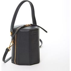 This black Harper leather bucket bag comes in a geometric shape and has a playful but sophisticated runway savvy look. With its gold hardware, its small handle allows the bag to swivel and be held in hand as a bucket. The top zipper will keep your contents secure while the cotton lined interior with 3 compartments keeps everything organized. This crossover barrel bag comes with a long and adjustable leather strap. OUTSIDE: Black Leather INTERIOR: Teal HARDWARE: Gold TOP WIDTH: 4.8″ BOTTOM WIDTH: 5.5″ HEIGHT: 6.5″ DEPTH: 5.5″ STRAP DROP: 15″-24" TOTAL STRAP LENGTH: 52″ Modern Bucket Bag With Zipper Closure, Luxury Bucket Bag With Zipper Closure, Modern Bucket Style Box Bag For Travel, Modern Bucket Shaped Box Bag For Travel, Modern Bucket Shape Box Bag For Travel, Modern Travel Bucket Shaped Box Bag, Modern Travel Bucket Shape Box Bag, Top Handle Bucket Bag With Zipper Closure, Top Handle Bucket Bag With Zipper For Shopping