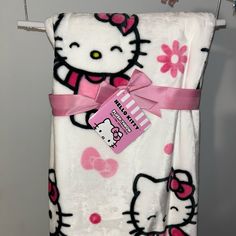 a hello kitty towel hanging on a clothes line