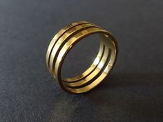 This listing is for a Cut Out Geometric Style Stainless Steel Ring.  The ring features a unique geometric cut out style design. These unisex rings are great for a subtle modern design. Type- Ring Sub-Type- Metal Ring Style- Modern, Geometric, Unisex Size- US/Canada Sizing, Size 7-11 Width- 81mm Thickness- 1mm Accents- Cut out stripe design Metal Type- Stainless Steel  Color- Gold  -BEADOLOGY BY HEATHER SAVINGS PROGRAM- -No Matter How Much You Buy- All domestic orders only pay a flat rate $3.85 f Unisex Rings, Star Chain, Cutout Design, Stainless Steel Ring, Special Jewelry, Unisex Ring, Ring Style, Unisex Jewelry, Metal Ring