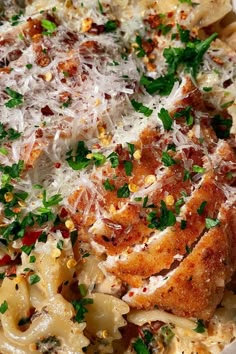 a white bowl filled with pasta and meat covered in parmesan cheese