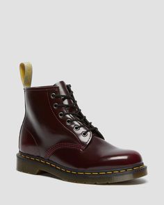 With 6 eyes, the 101 sits lower on the ankle — but is still an instantly recognizable Dr. Martens silhouette. Clean, sharp and solid, the boot combines utilitarian work wear with classic lines, puritan stitching and unmistakable attitude. This version of the boot is 100% vegan, using a black synthetic material called Felix Rub-Off. 100% vegan construction Adopted by workers. Subverted by rebels. Clean, sharp and bold, our 6-eye 101 boot combines classic utilitarian workwear with unmistakable Dr. Dr Martens Cherry Red, Cherry Red Dr Martens, Red Dr Martens, Clothes Wishlist, Vegan Boots, Boots Uk, Danner Mountain Light Boot, Goodyear Welt, Girls Wear