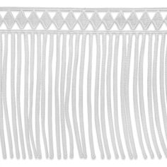 a white wall hanging with fringes on it