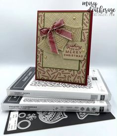 three books stacked on top of each other with the words merry christmas written on them