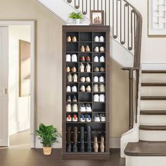 an open shoe rack in the middle of a stair case next to a set of stairs